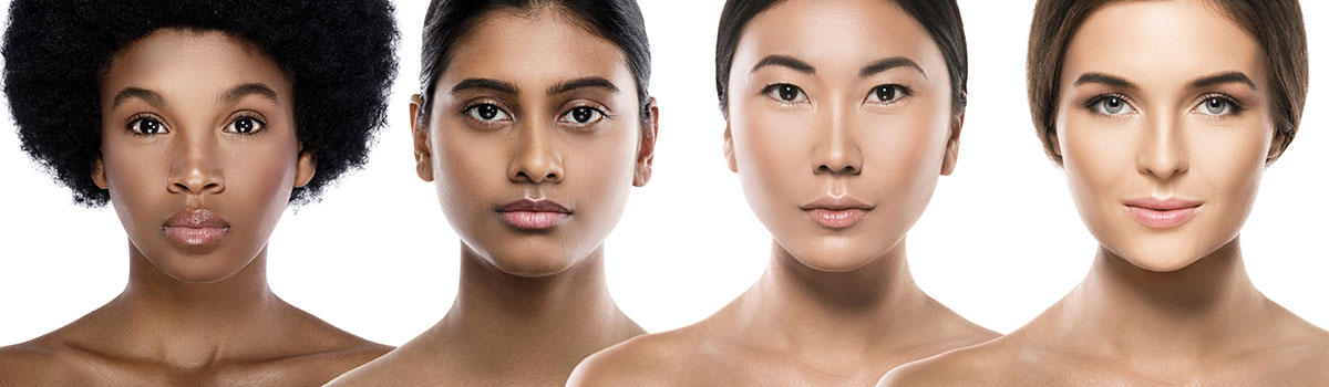 Busts of four women of diverse ethnicities with healthy facial skin