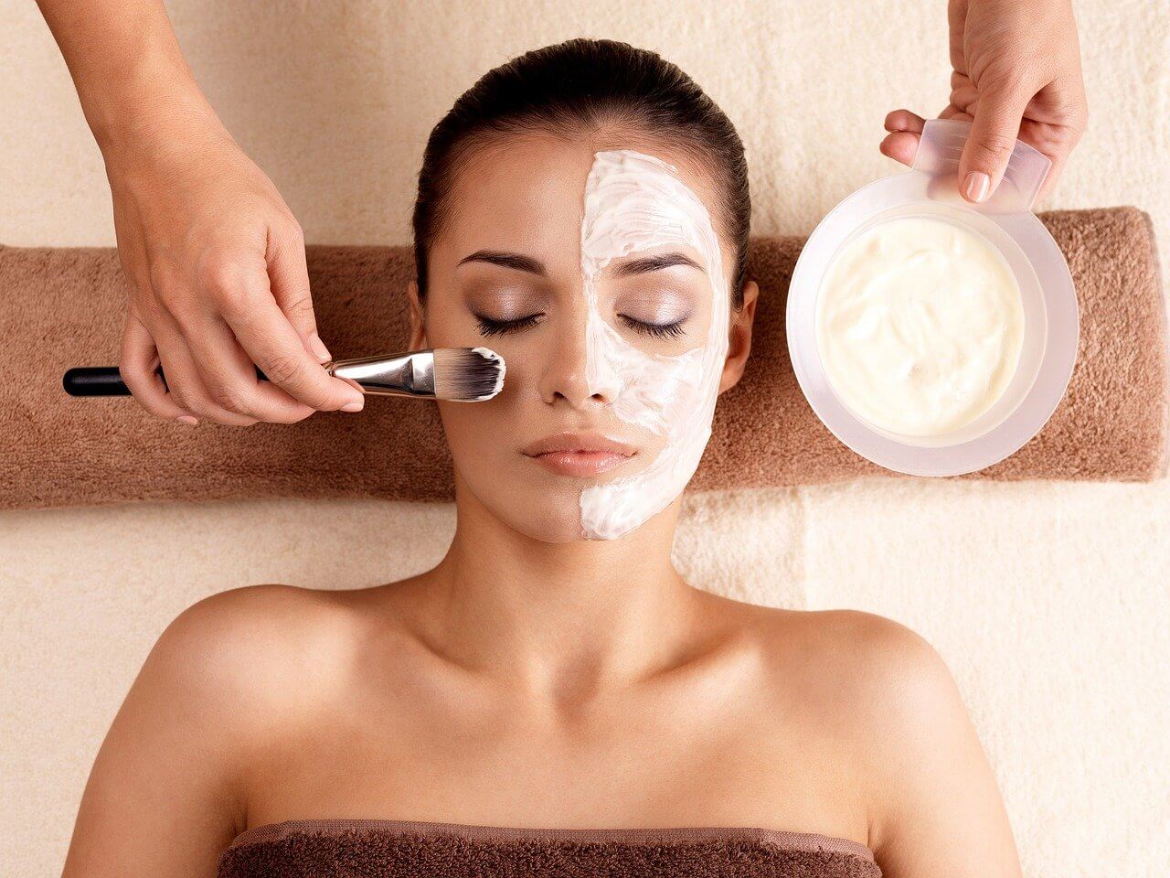 A woman receiving a chemical peel facial treatment in Houston