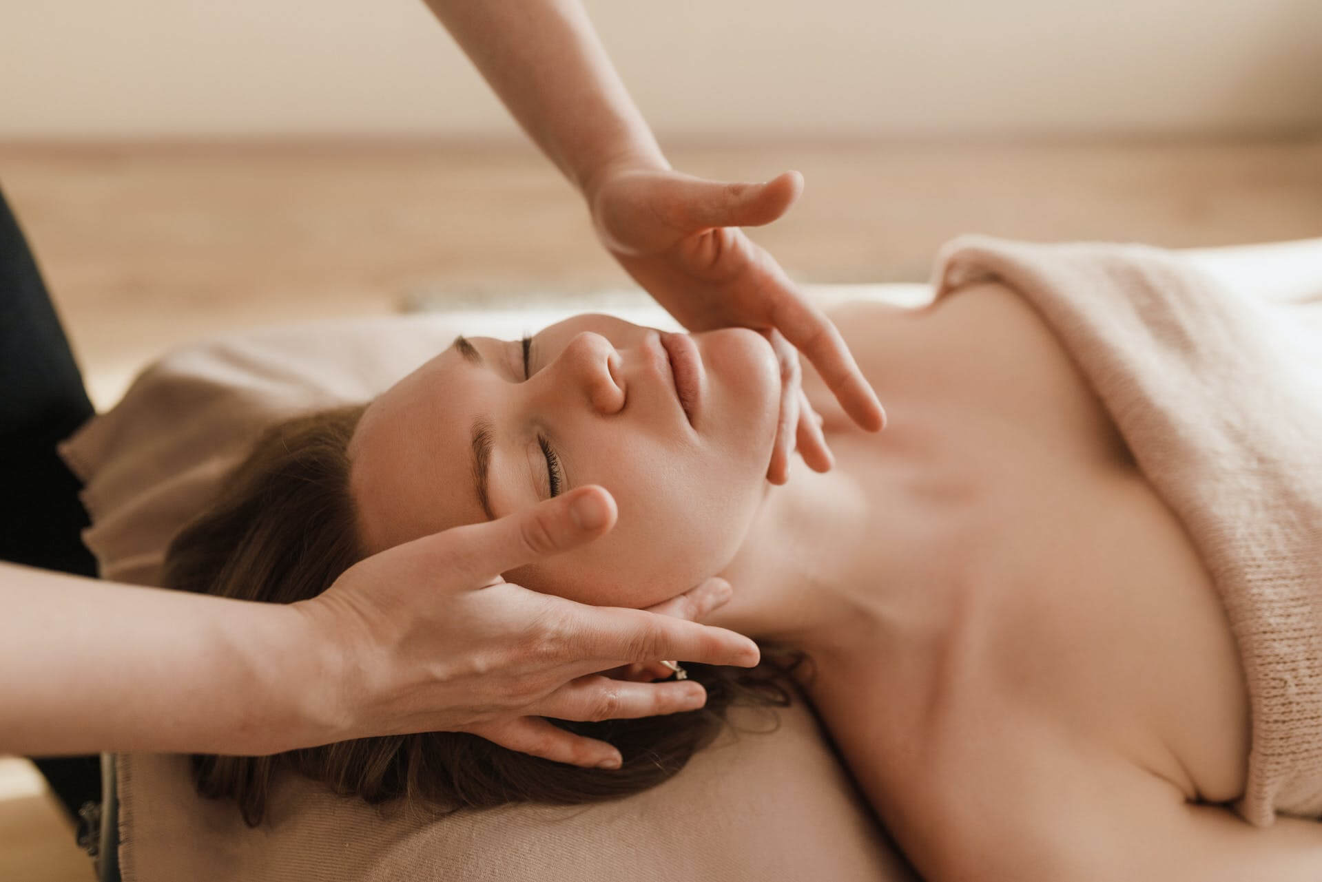 A woman getting a massage spa package.