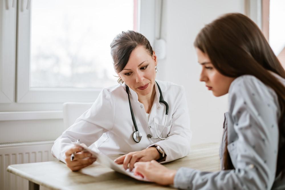 A doctor explains micronutrient testing to a patient