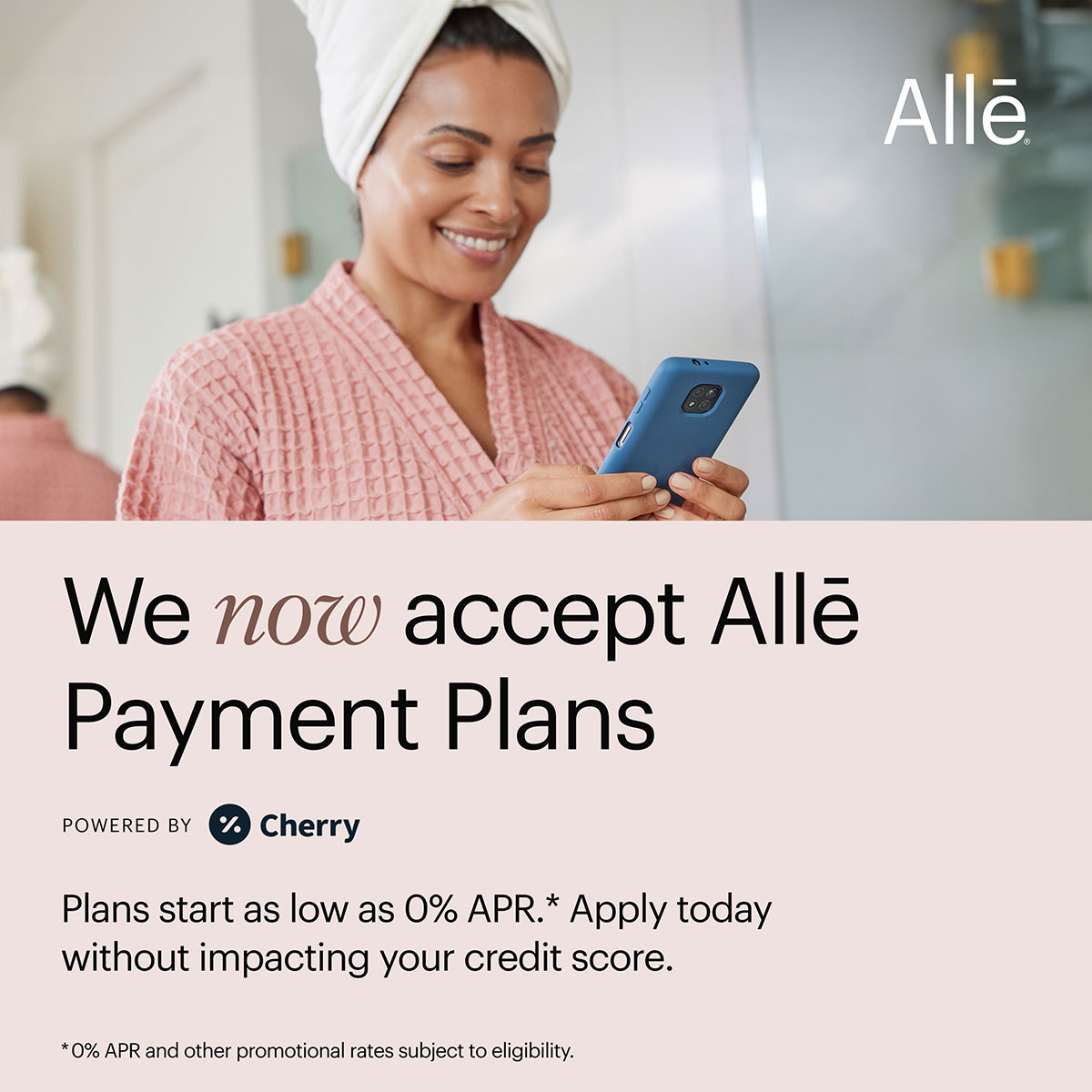 A woman in a robe manages her Allē Pay aesthetic service payment plan through an app on her phone