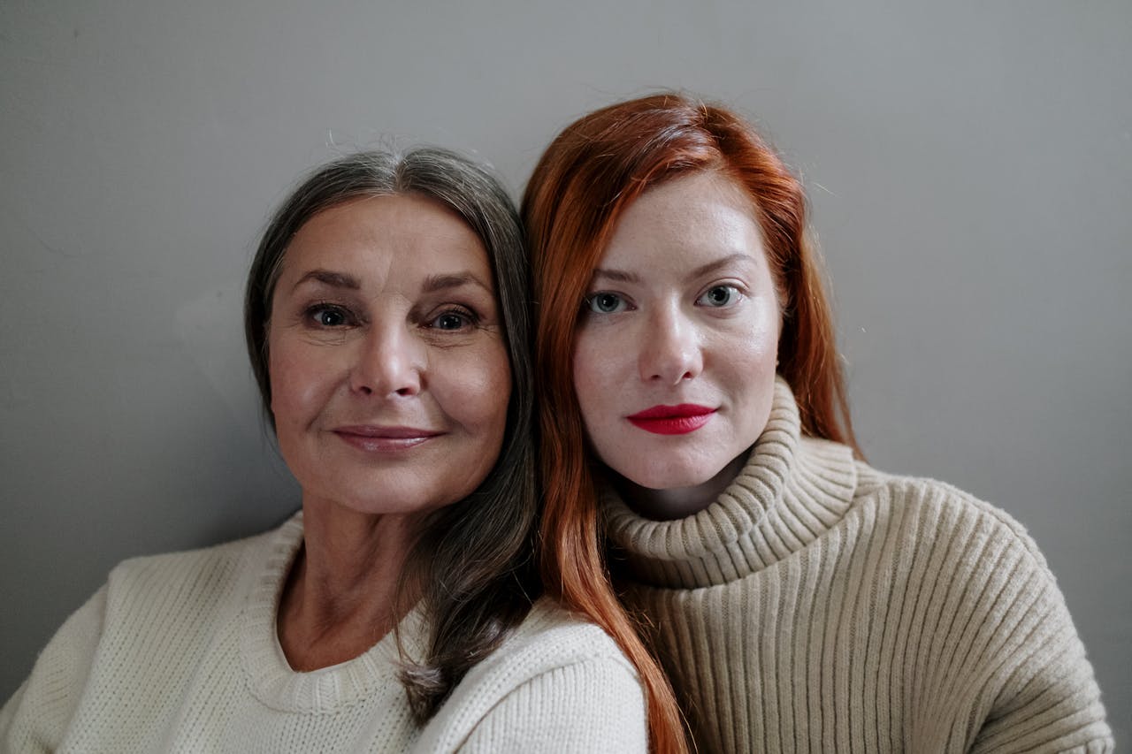 Close-up of older and younger woman posing