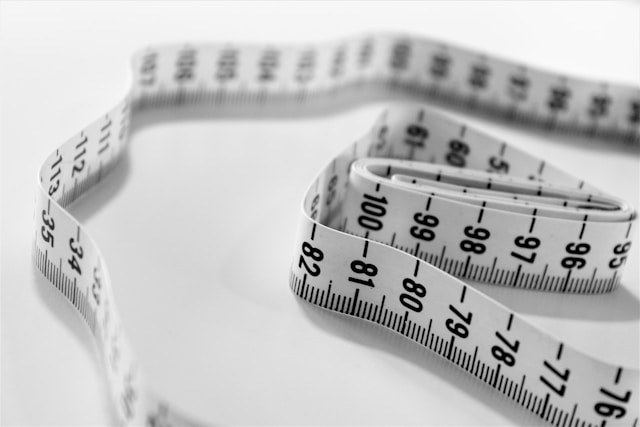 Close-up image of white measuring tape