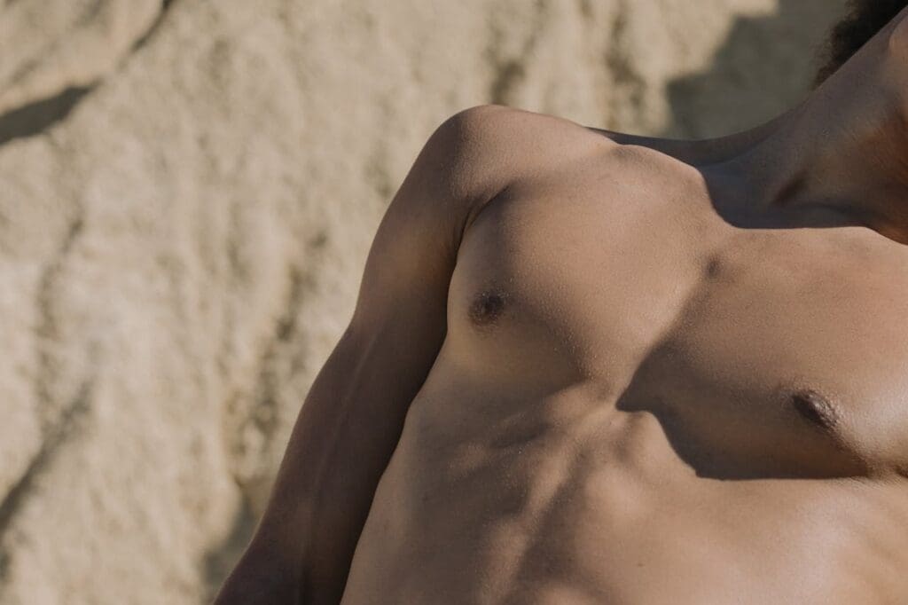 Close-up of smooth, bare-chested male