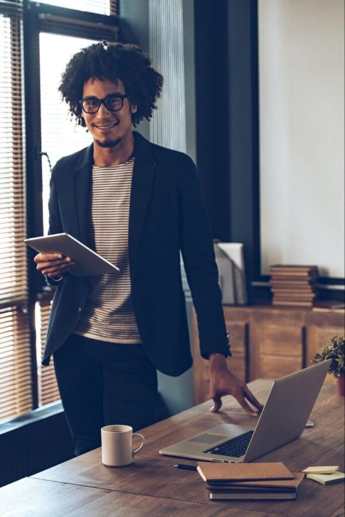 A focused professional holding a tablet